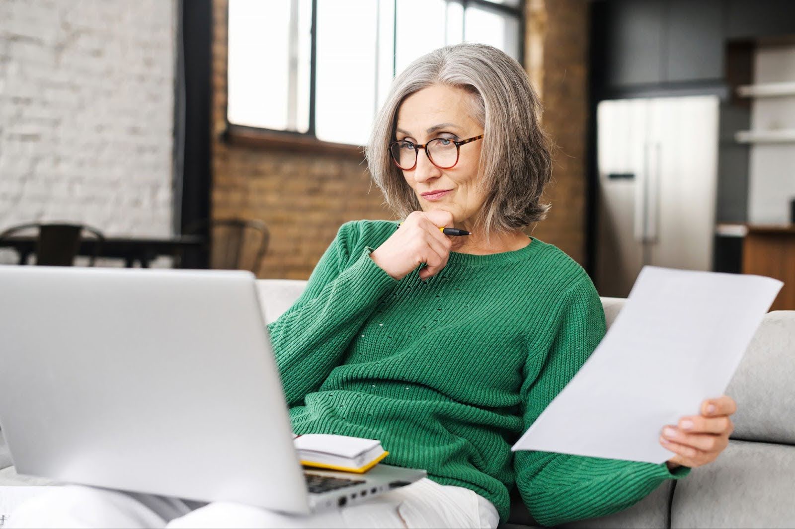 Senior woman looking at senior living communities online