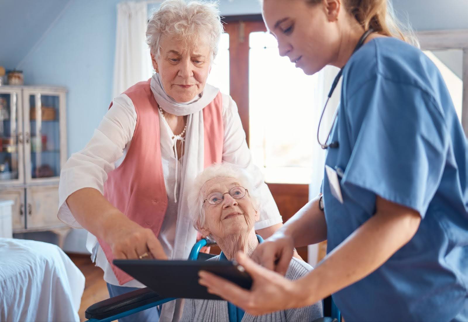 Nurses helping a senior woman