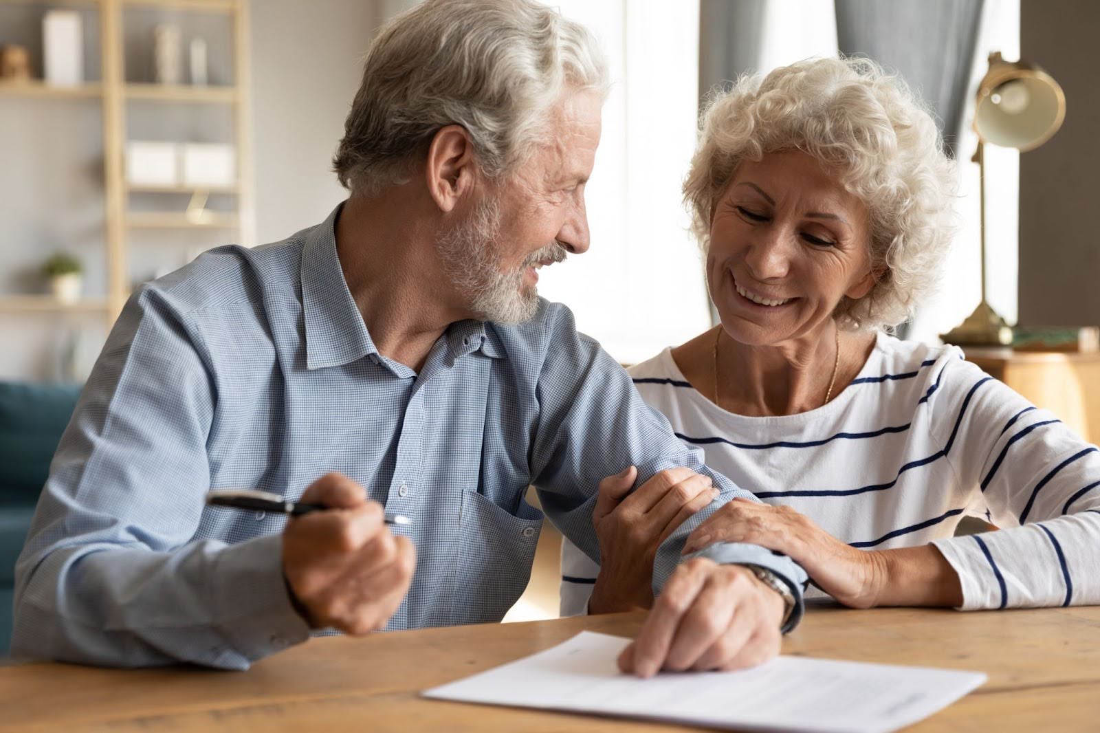 Senior couple filling out waitlist form